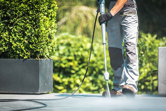 Pressure washing an exterior patio
