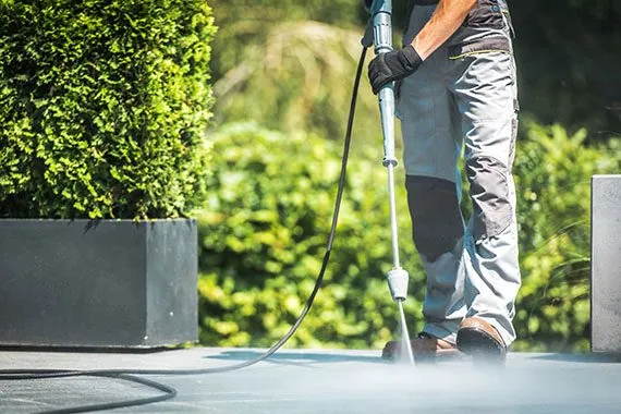 Pressure washing an exterior patio